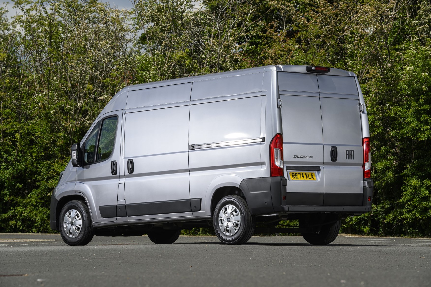 Image of a 2025 Fiat Ducato, in silver, viewed from the rear left corner