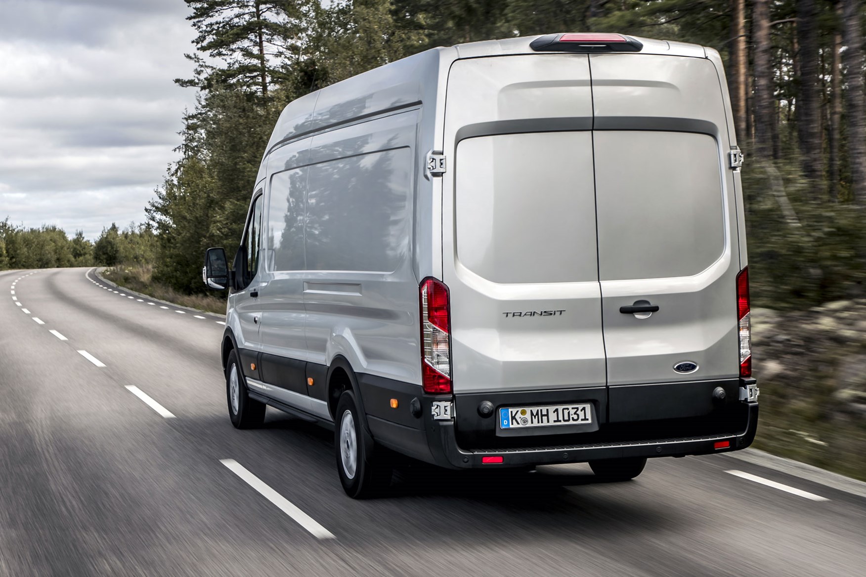 Ford Transit review - 2019 facelift model, rear view, driving, silver