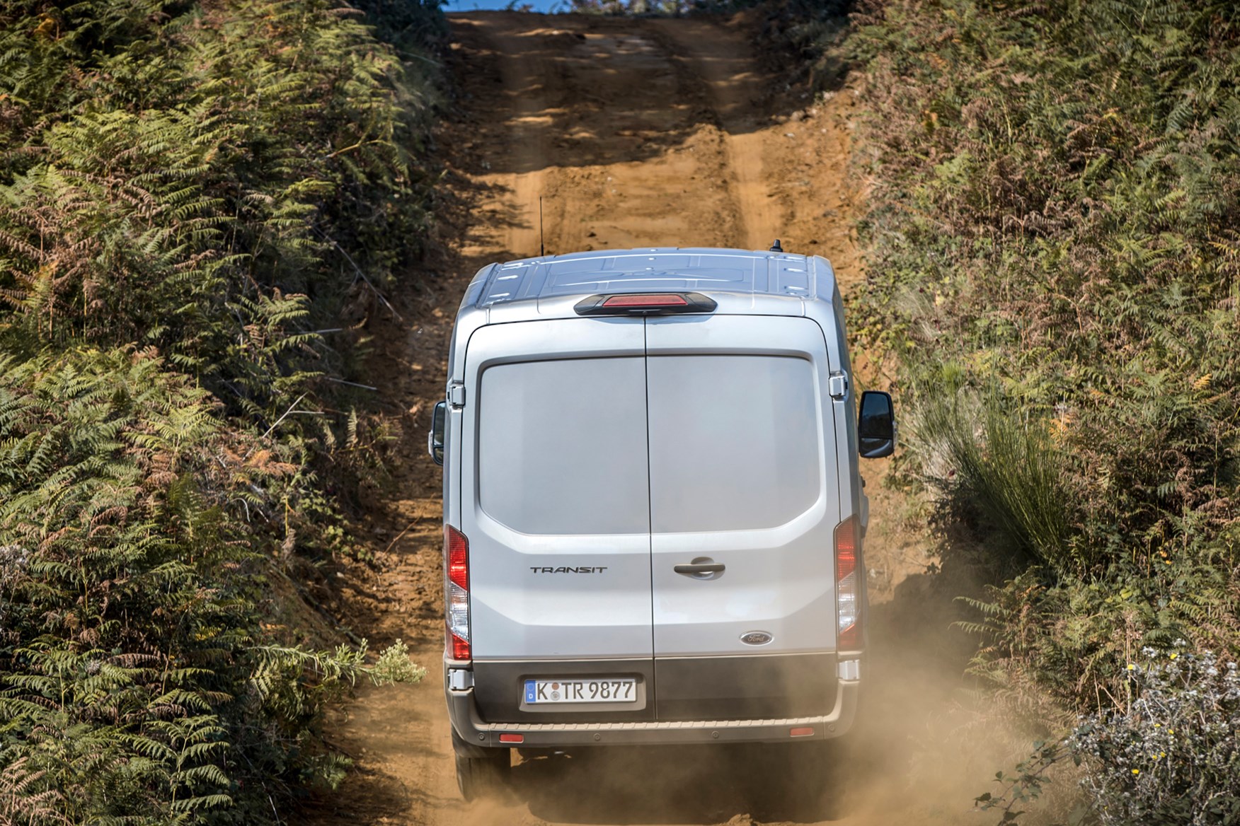 Ford Transit Trail review, 2020, all-wheel drive, AWD, 4x4, rear view, driving off-road up slope