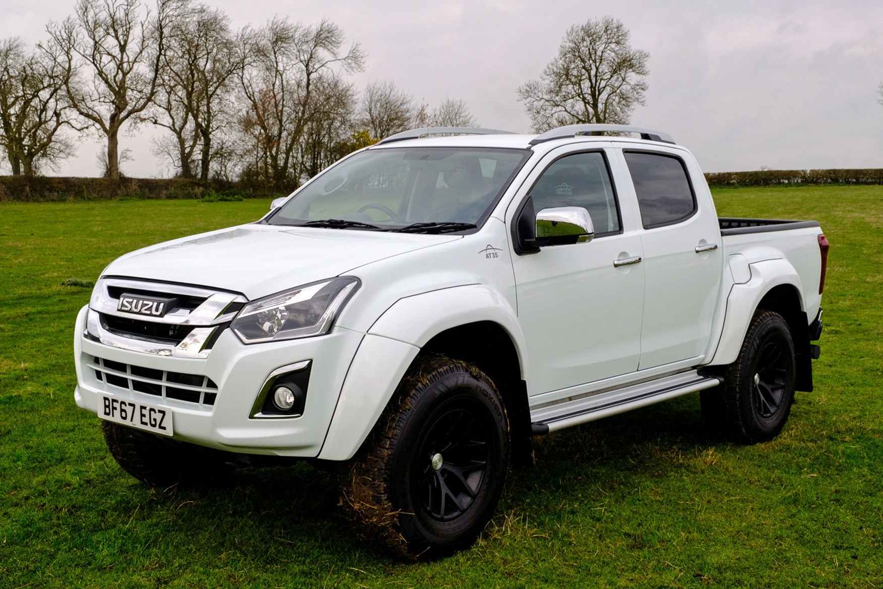 Isuzu D-Max AT35 1.9 review - front view, in field, white