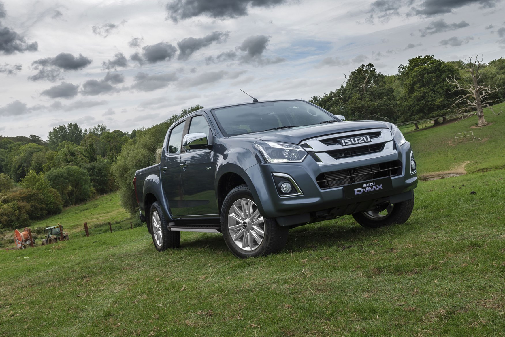 Isuzu D-Max Yukon review - grey, front view, parked in field