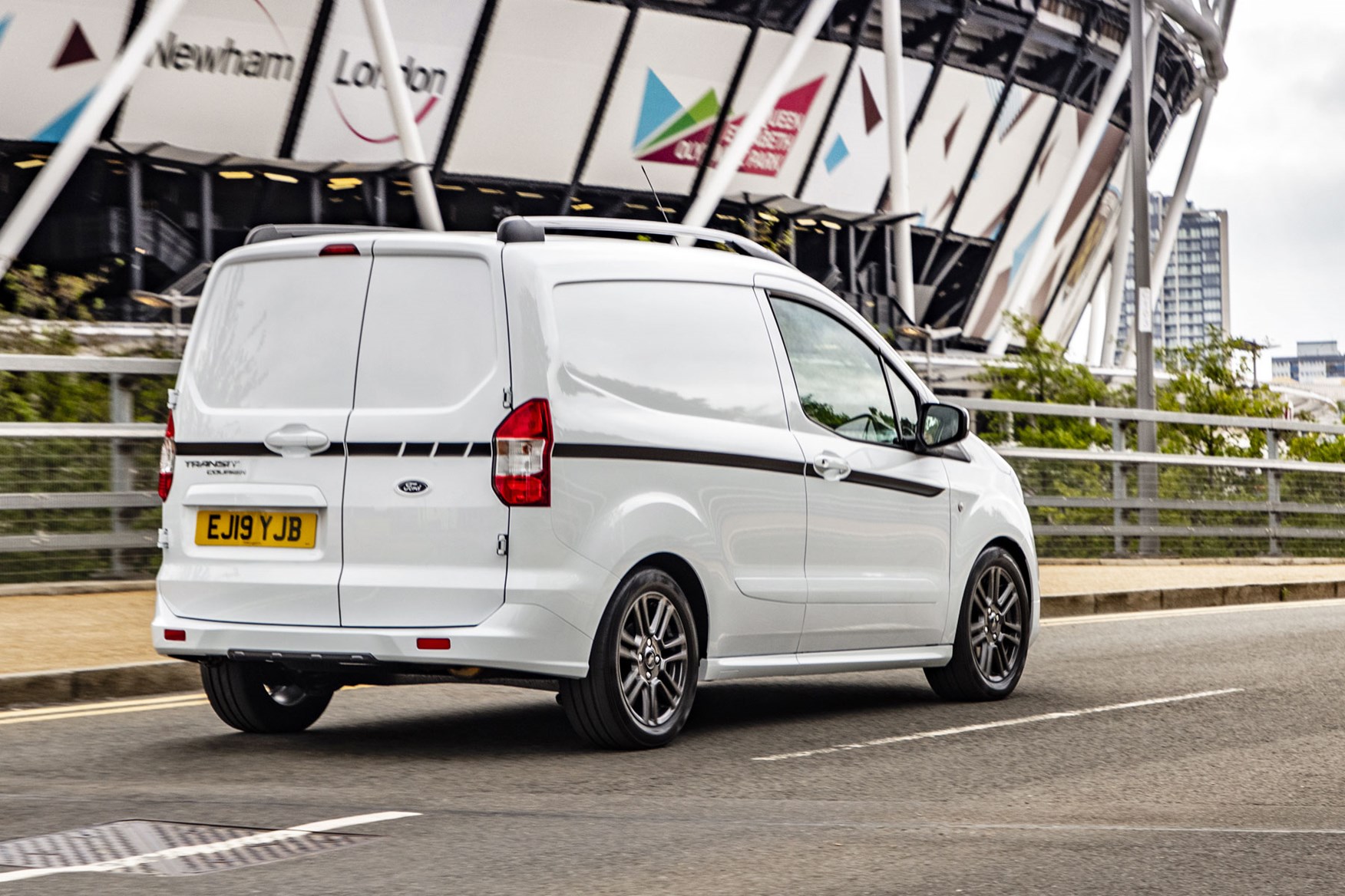 Ford Transit Courier review, 2019 facelift model, rear view, white, driving, Sport
