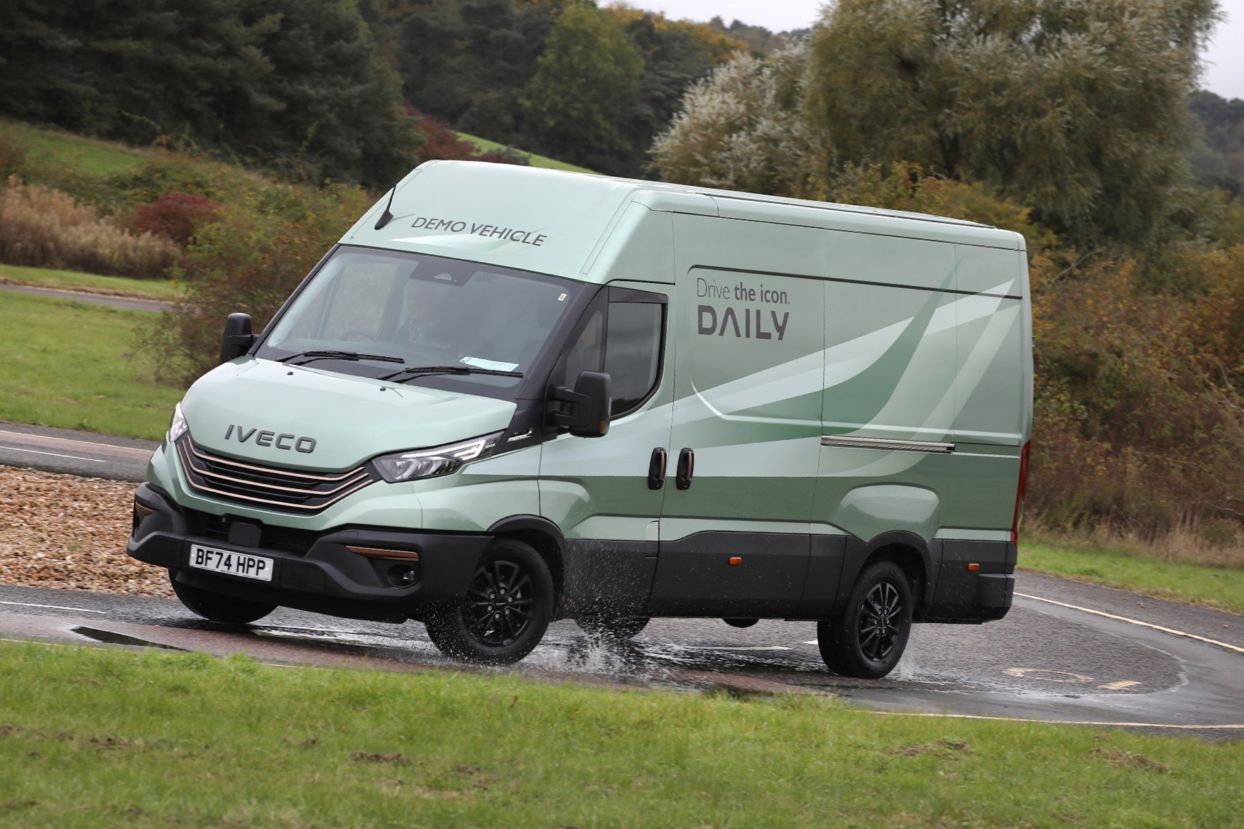 Iveco Daily review - MY24, front, green, driving round corner