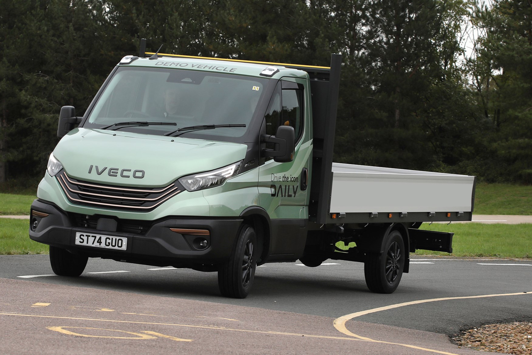 Iveco Daily review - MY24, dropside, front, green, driving round corner