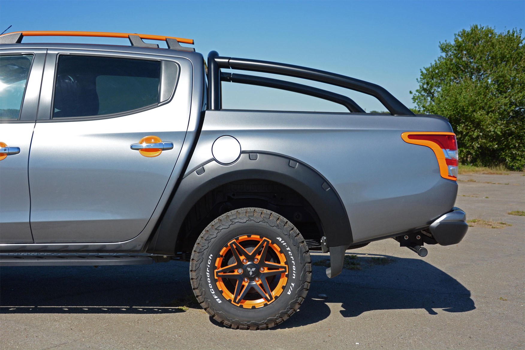 Mitsubishi L200 Barbarian SVP II review - rear side detail showing wheels, tyres, arch extensions, light surrounds