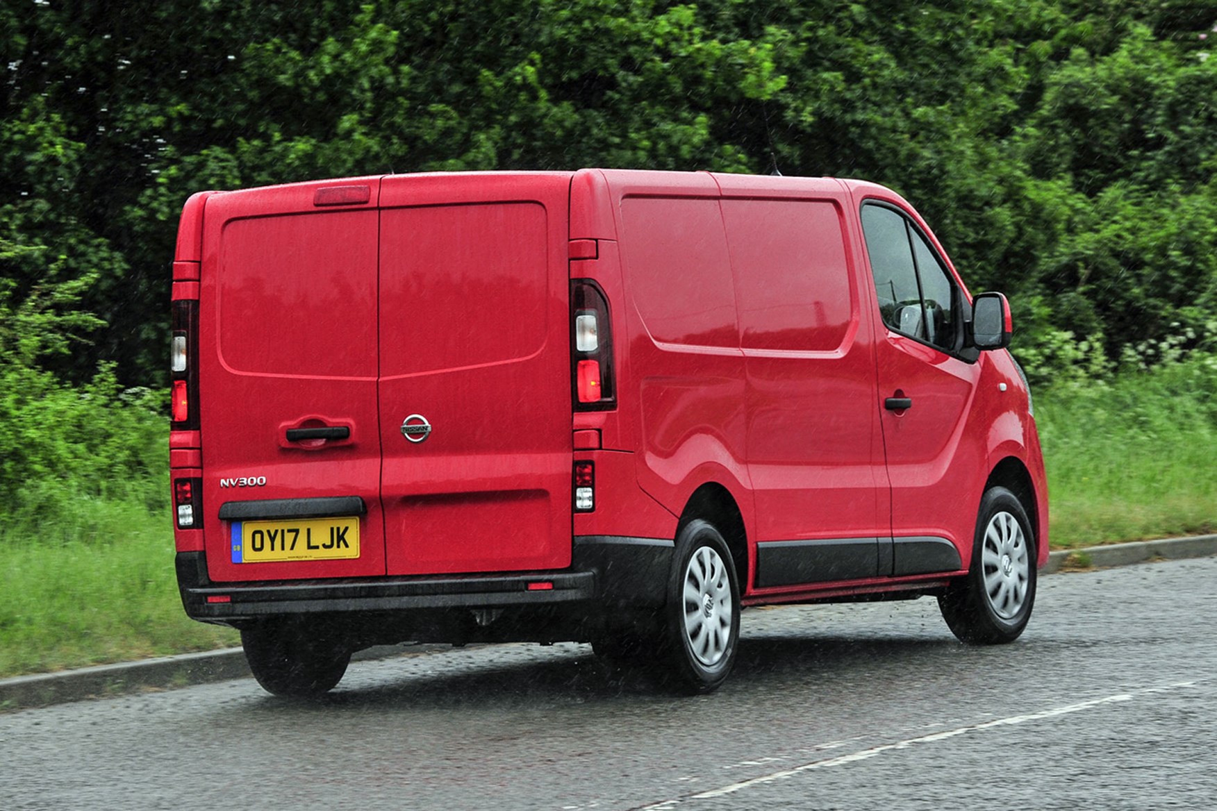 Nissan NV300 - red, rear view, UK, driving in the rain, 2017