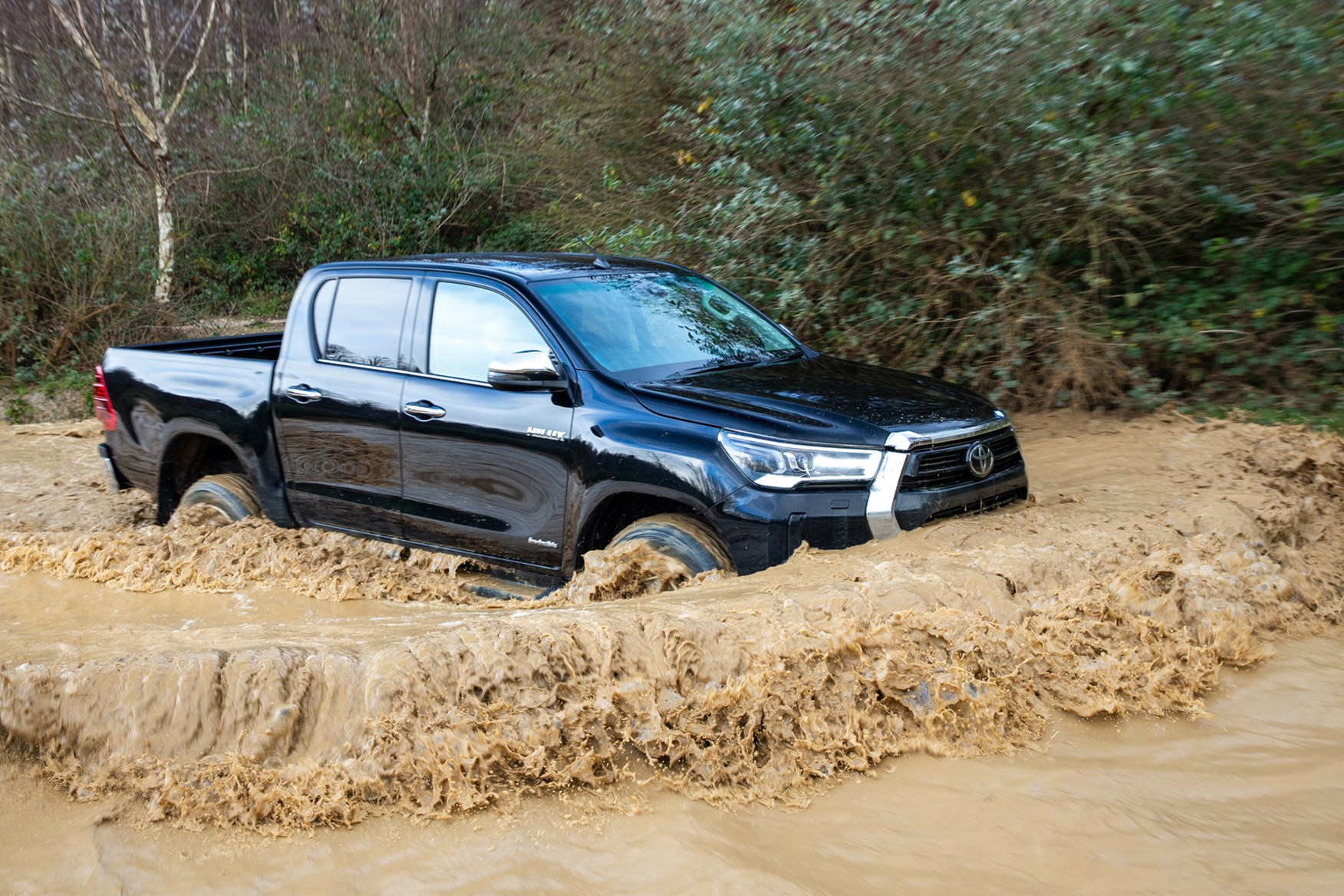 Toyota Hilux review, 2020 facelift, Invincible, bow wave in muddy water, black