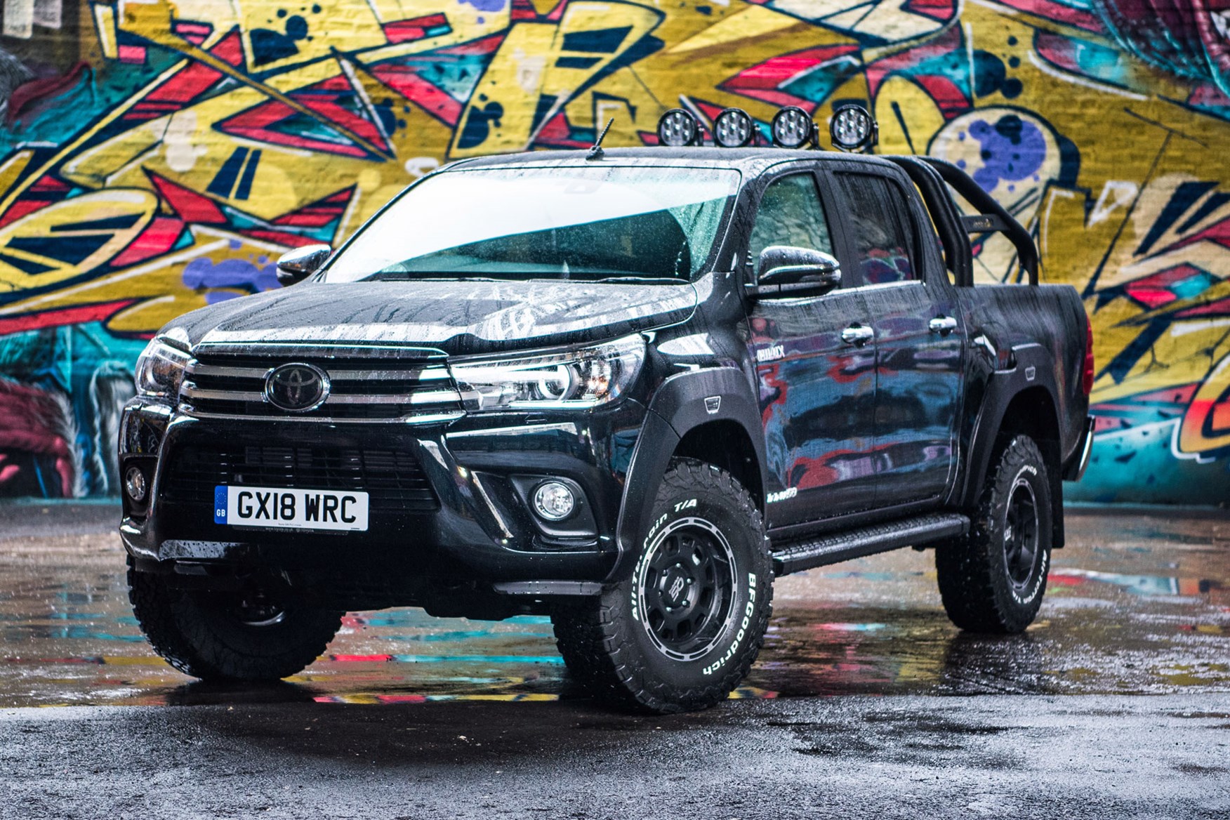 Toyota Hilux Invincible 50 review - front view, black, in the rain