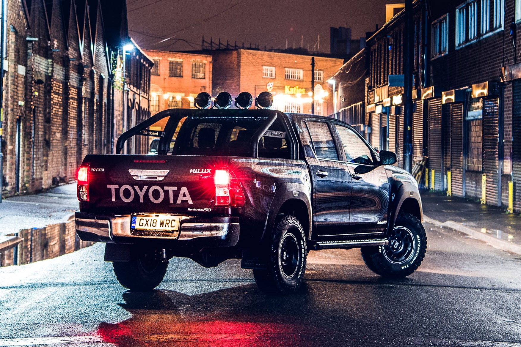 Toyota Hilux Invincible 50 review - rear view, black, at night