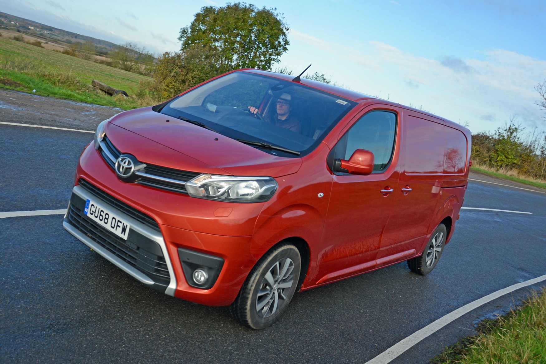 Toyota Proace automatic review - front view, orange, driving round corner, 2019