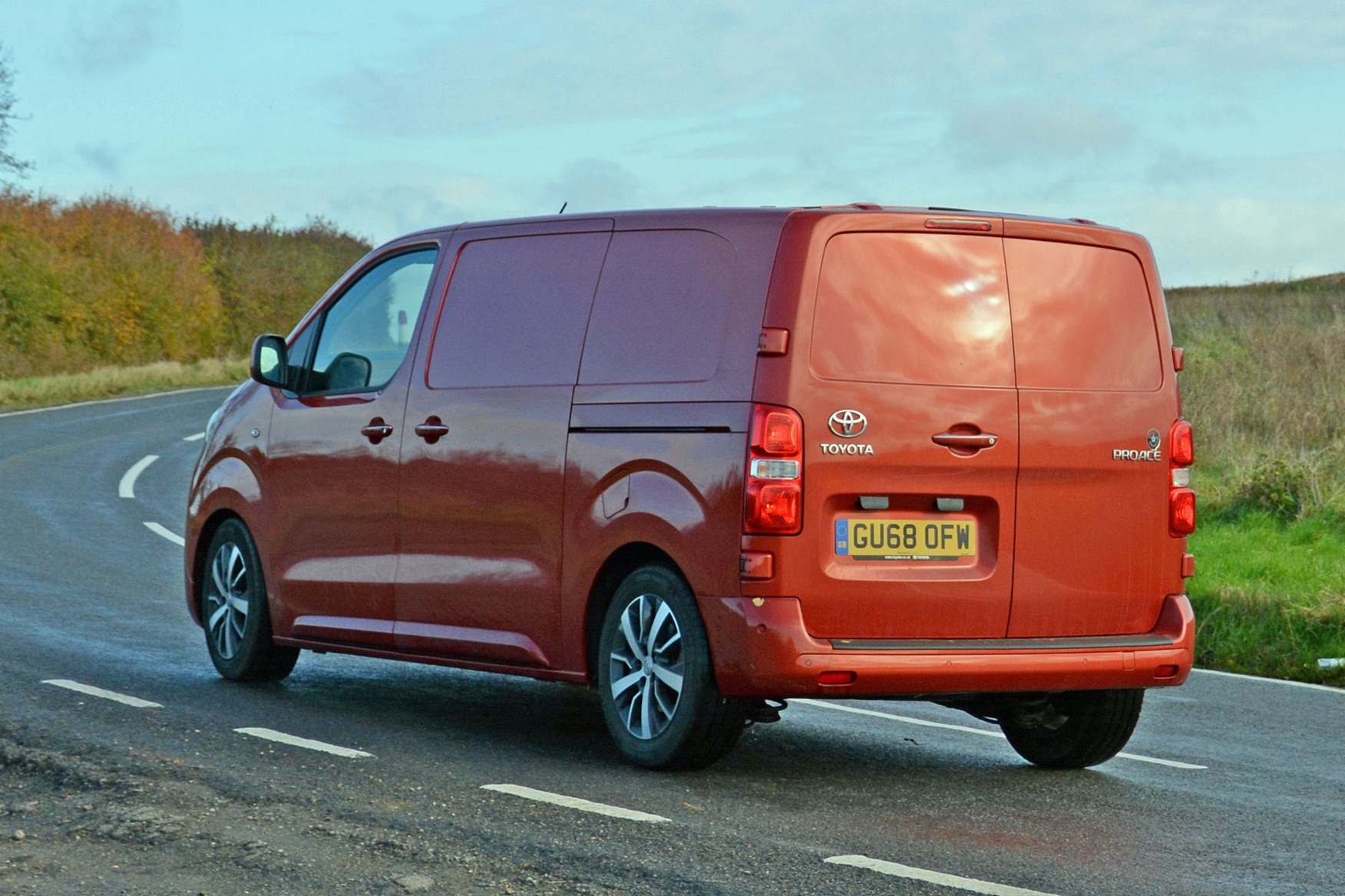 Toyota Proace automatic review - rear side view, driving round corner, orange, 2019