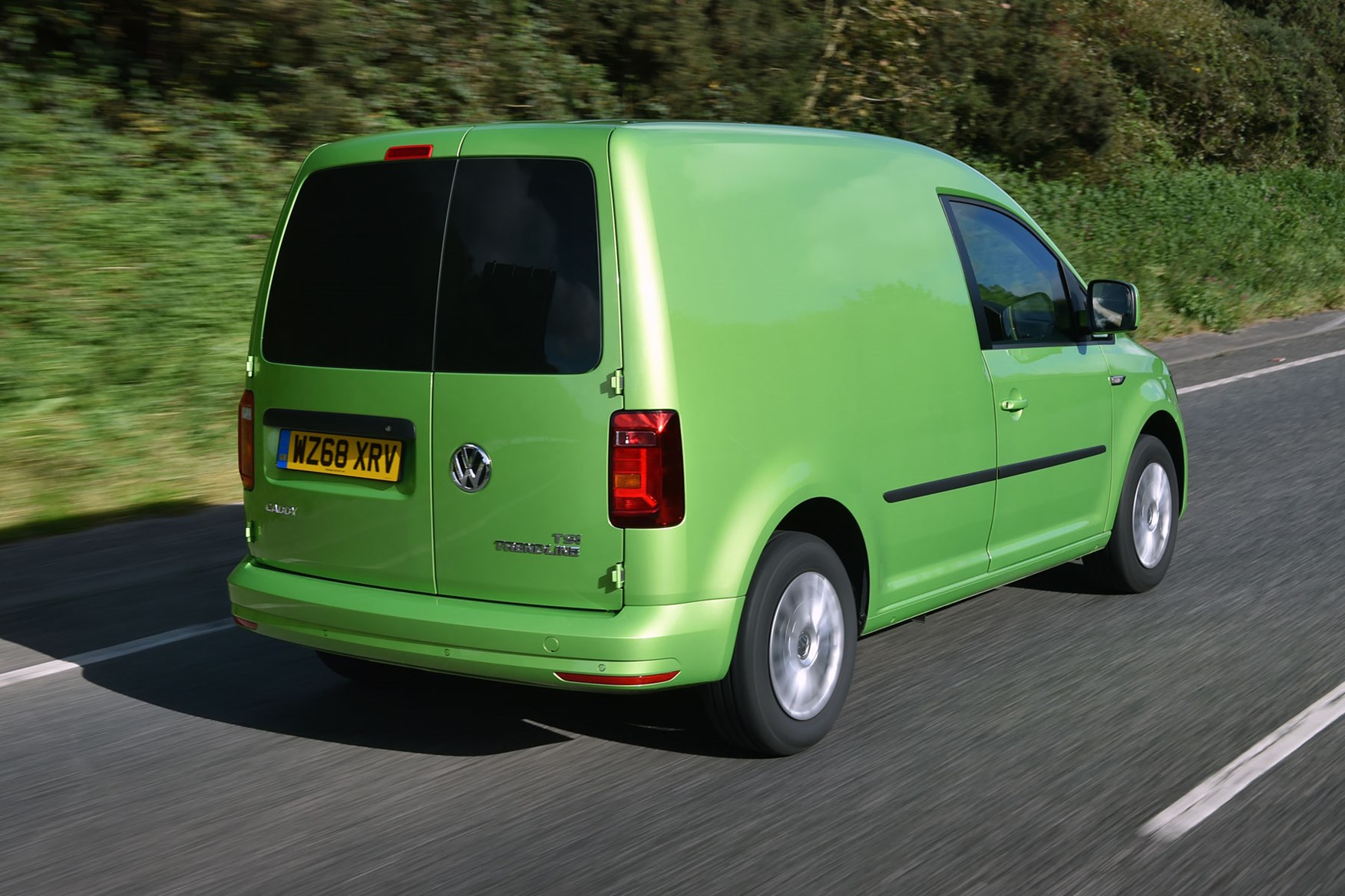 VW Caddy review - 2018 model, rear view, driving, green