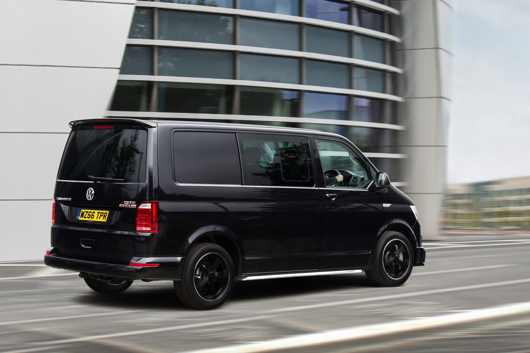 VW Transporter T6 Sportline review - kombi, black, rear view driving