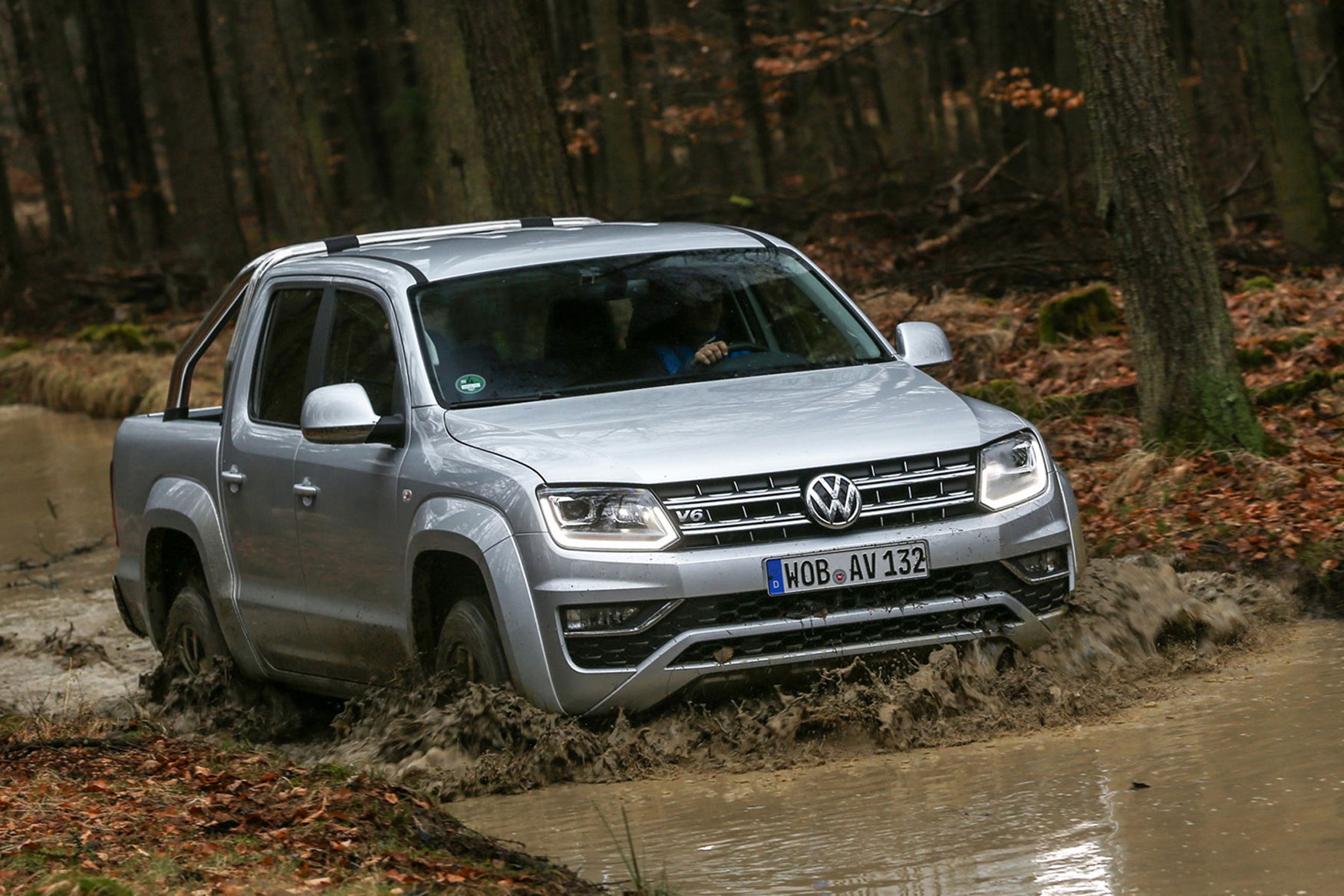 VW Amarok V6 Trendline 204hp review - front view, driving through muddy river, silver