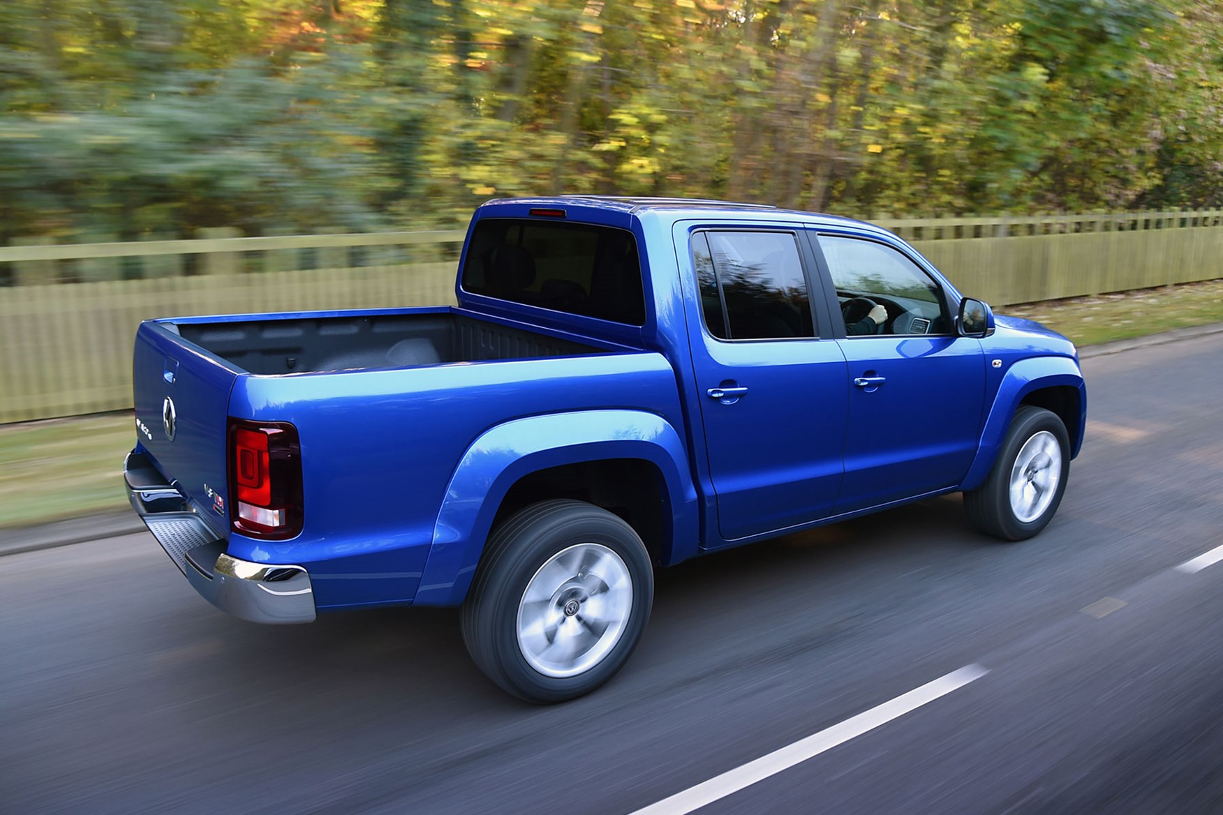 VW Amarok V6 Aventura 224hp review - rear view, driving on road, blue