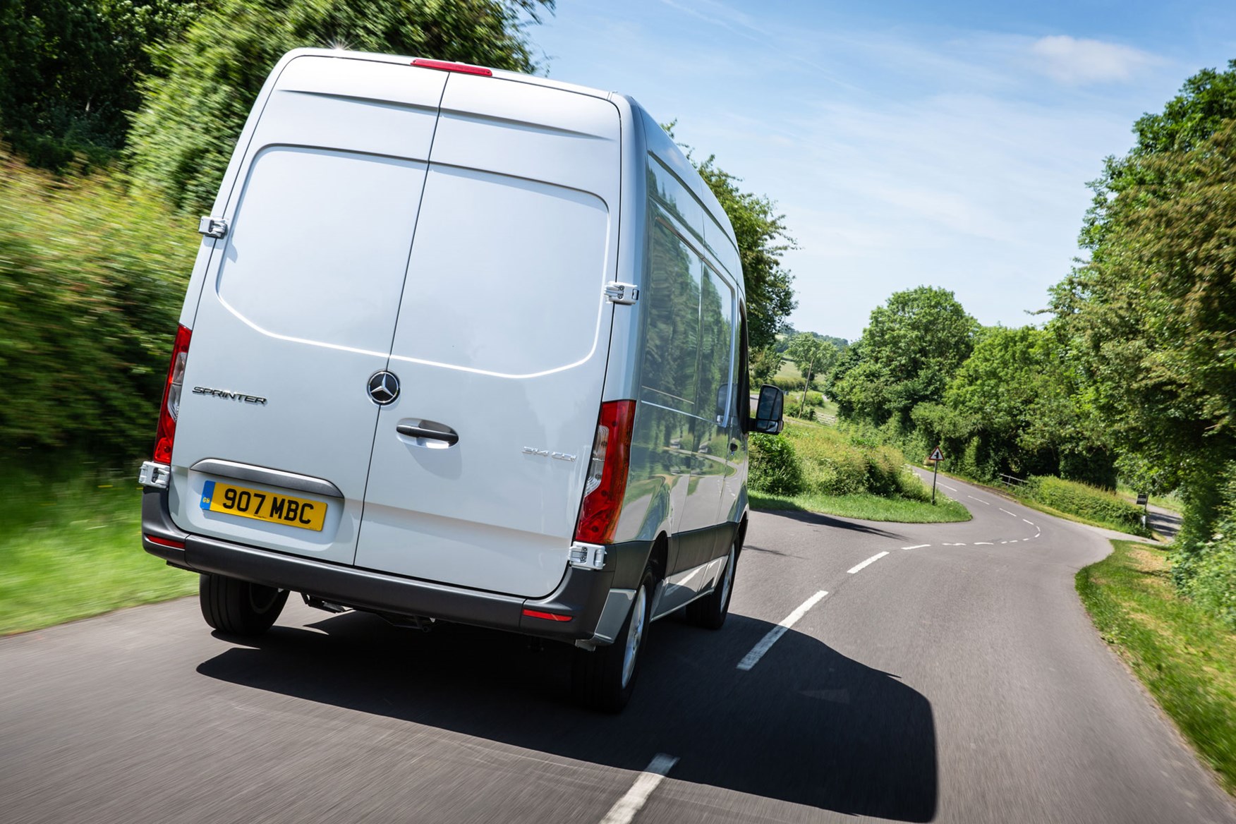 Mercedes Sprinter (2018-on), rear view, silver, UK, driving on country B-road
