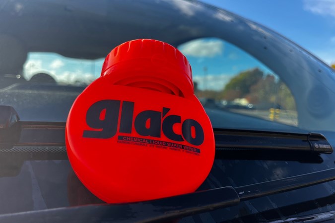 A bottle of Glaco on a car's windscreen
