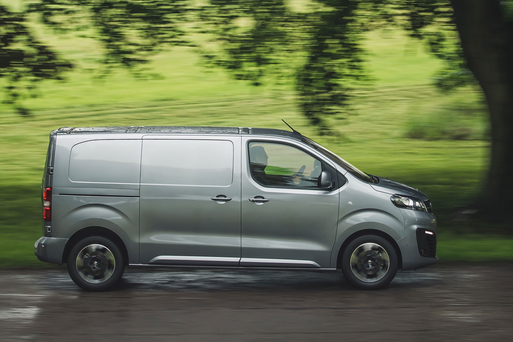 Vauxhall Vivaro review - side view, silver, driving in the rain