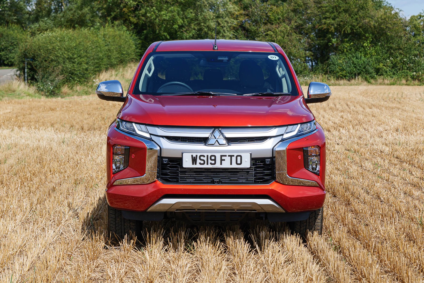 2019 Mitsubishi L200 Barbarian X, front view with LED headlights and foglights, Sunflare Orange