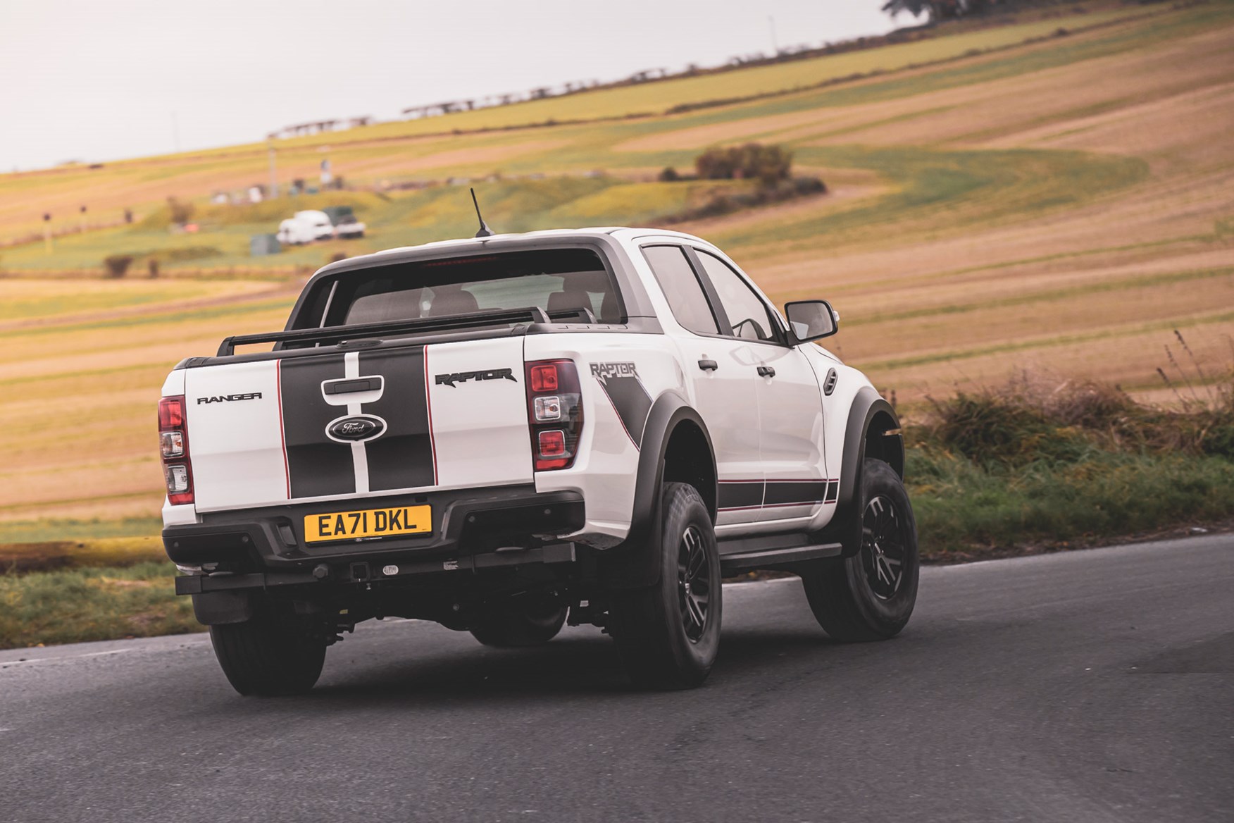 Ford Ranger Raptor review - Special Edition rear view, driving round corner