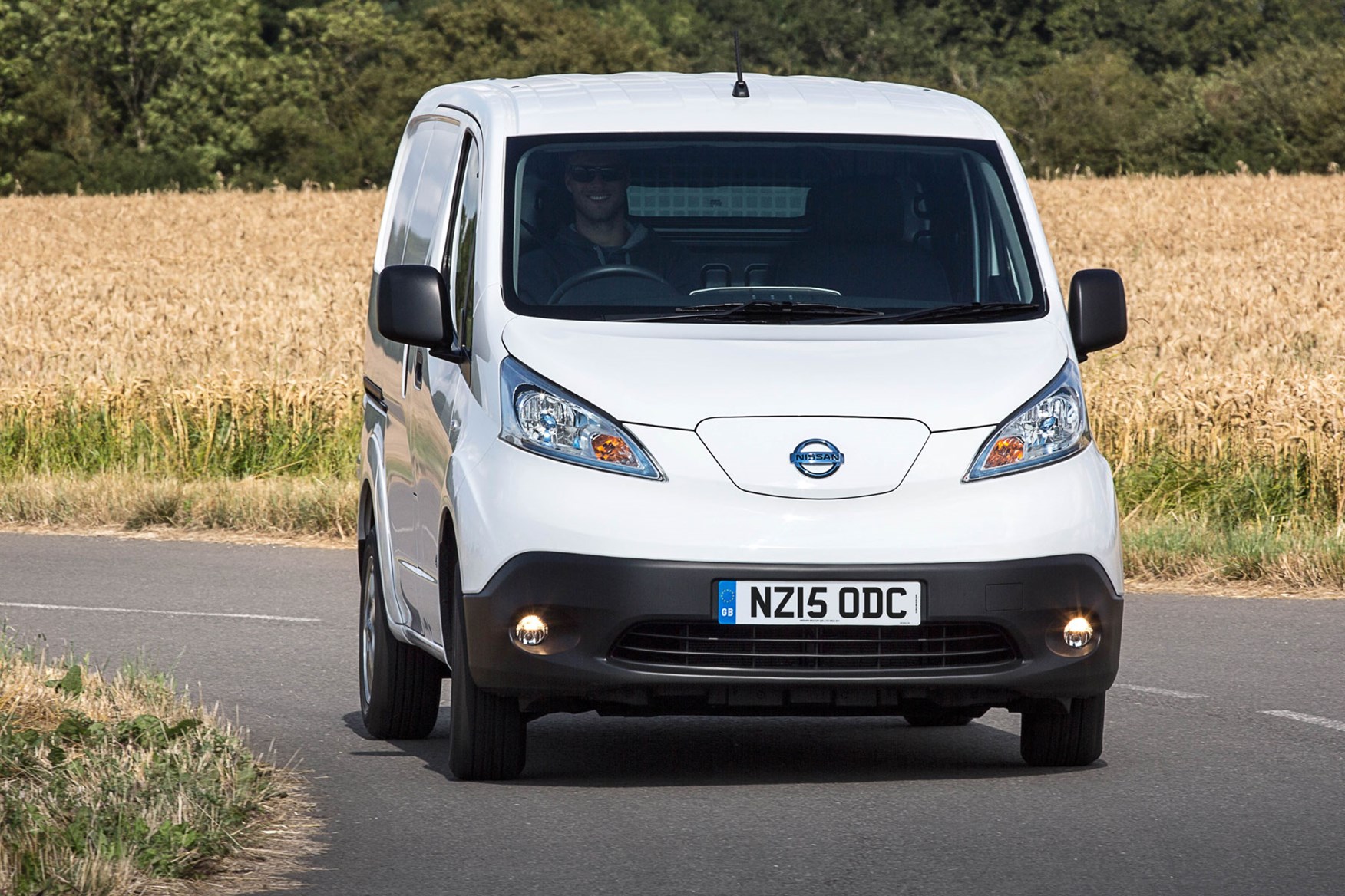 Nissan e-NV200 review, 2020, white, front view, driving round corner