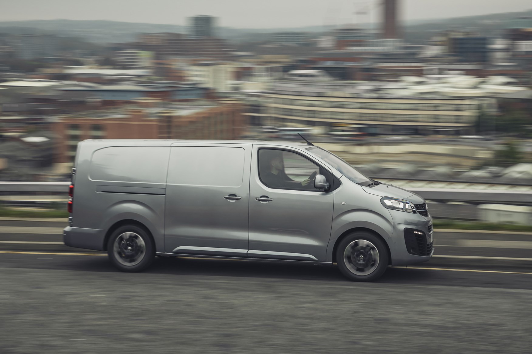 Vauxhall Vivaro-e review, 2020, electric van, side view, driving, grey