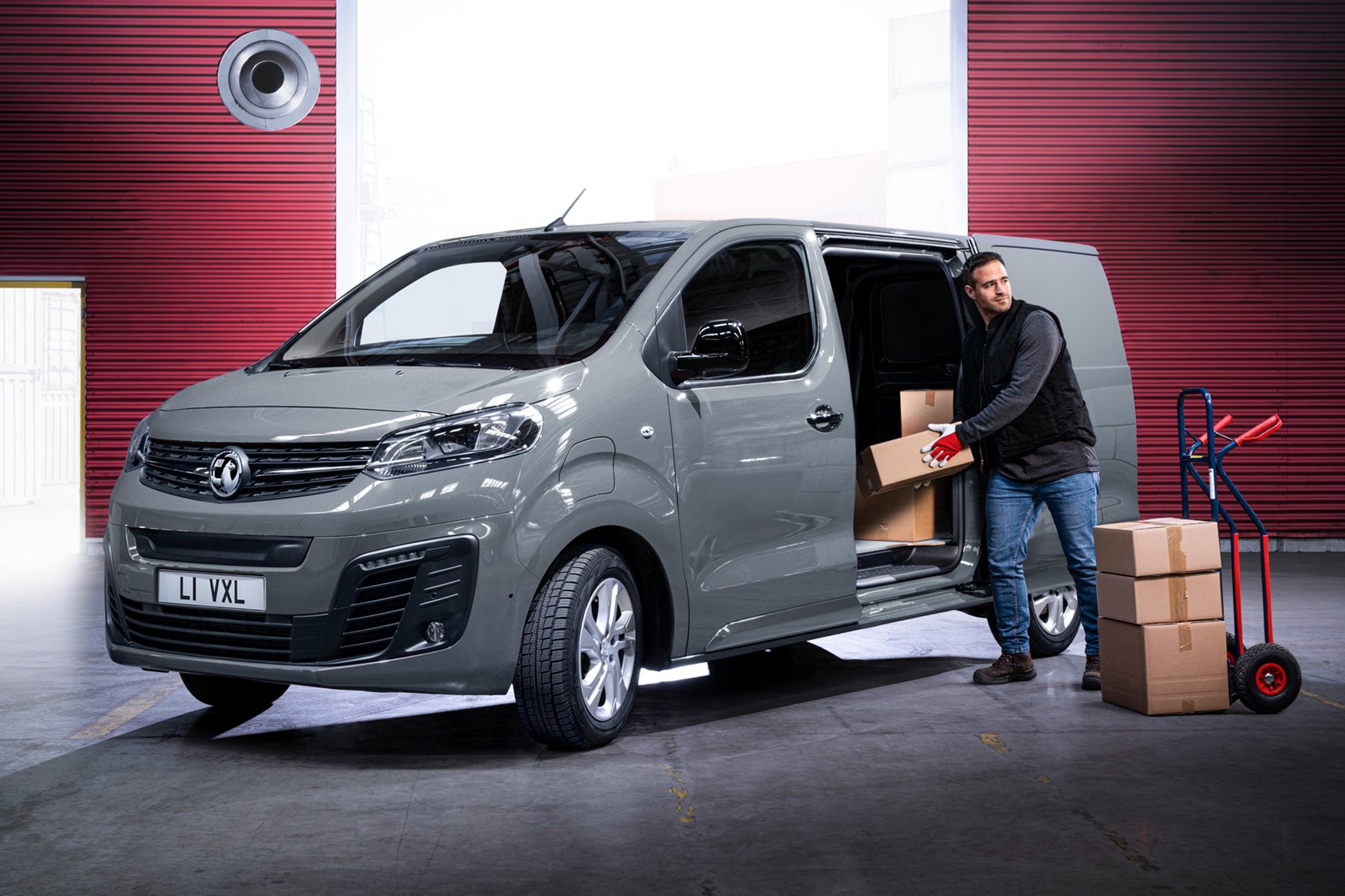 Vauxhall Vivaro-e review, 2020, electric van, front  view, being loaded, grey