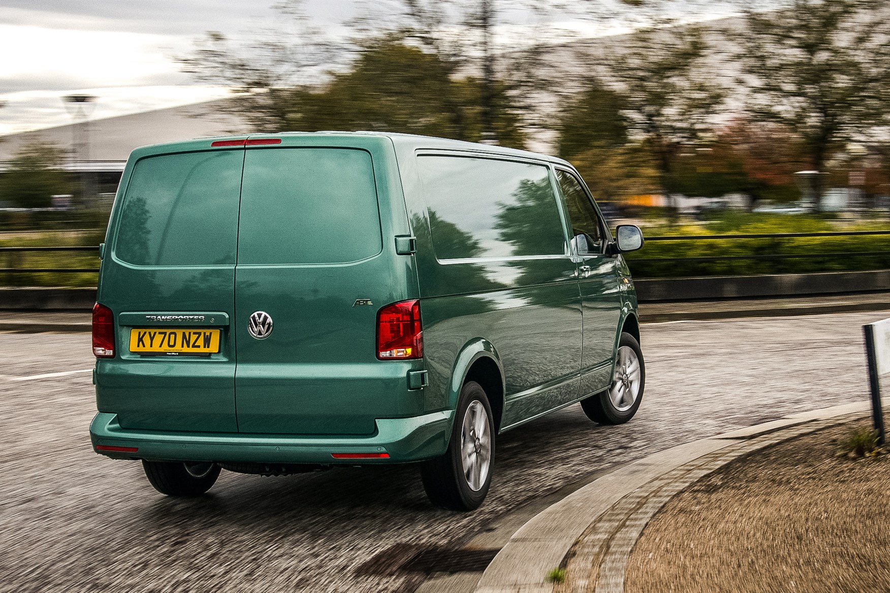 Volkswagen e-Transporter electric van review, 2020, rear view, driving round corner, green