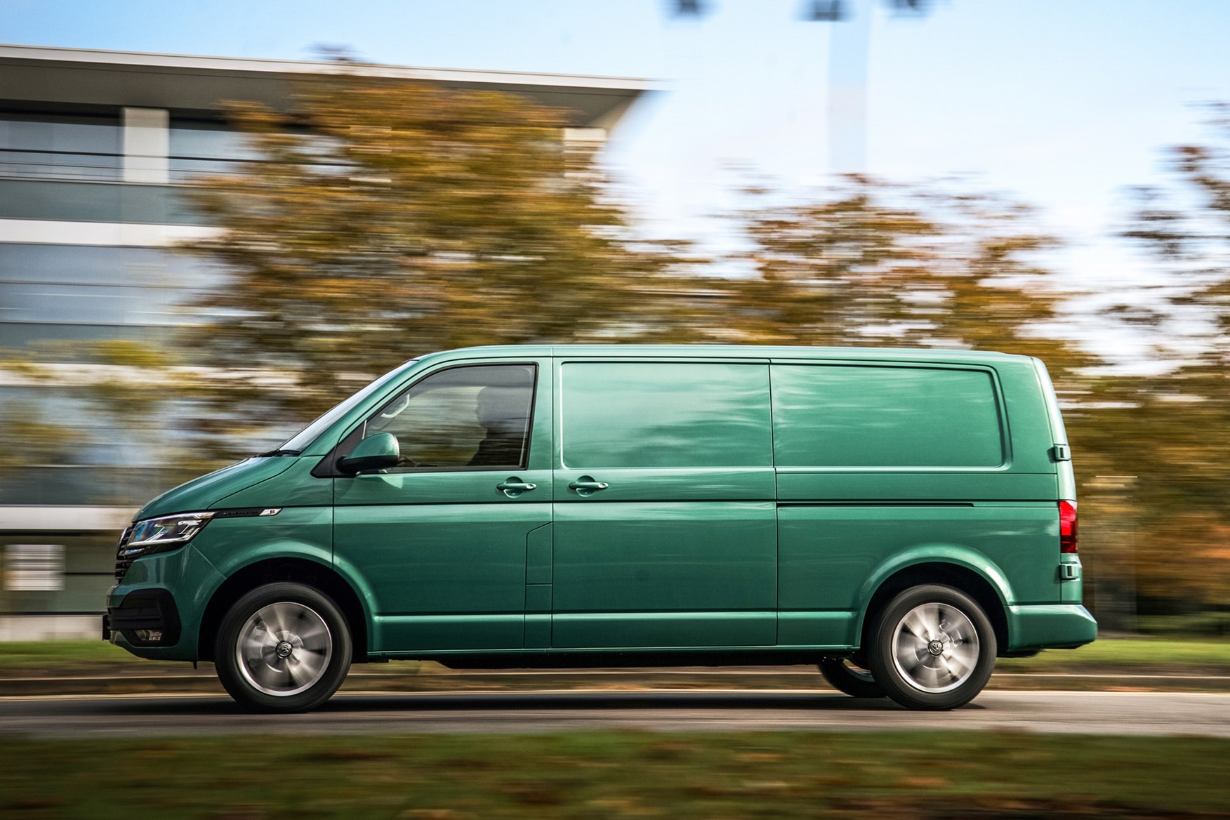 Volkswagen e-Transporter electric van review, 2020, passenger side, driving, green