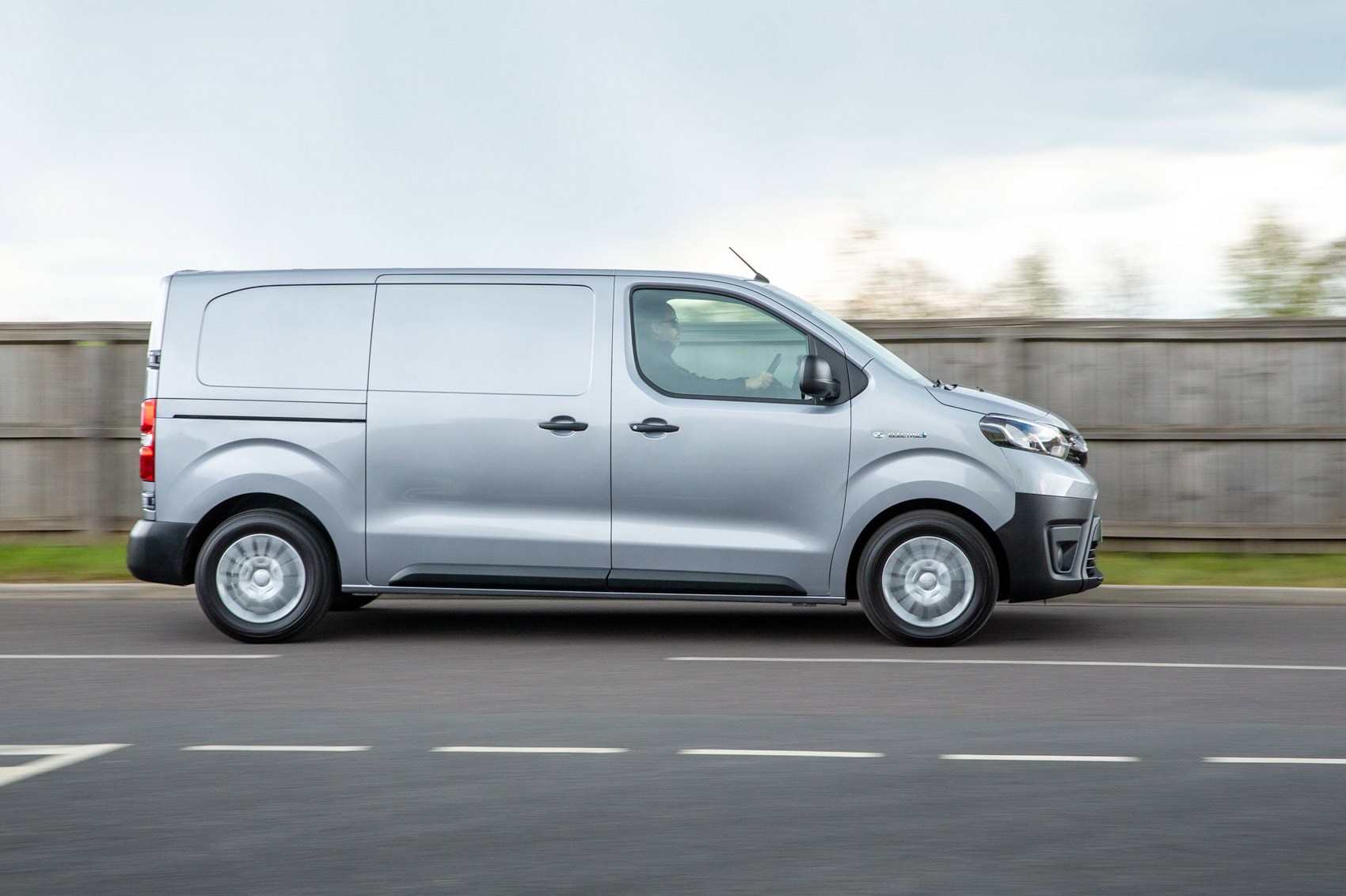Toyota Proace Electric van review, side view, driving, silver