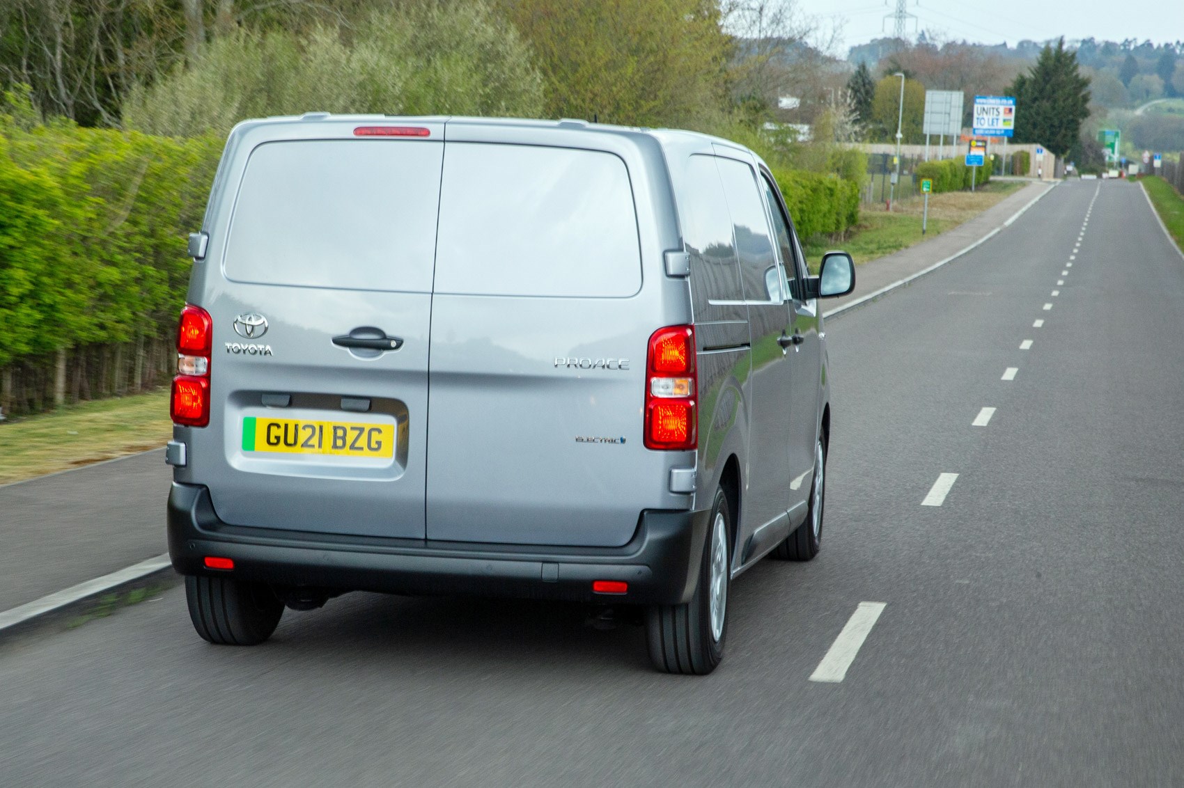 Toyota Proace Electric van review, rear view, driving, silver