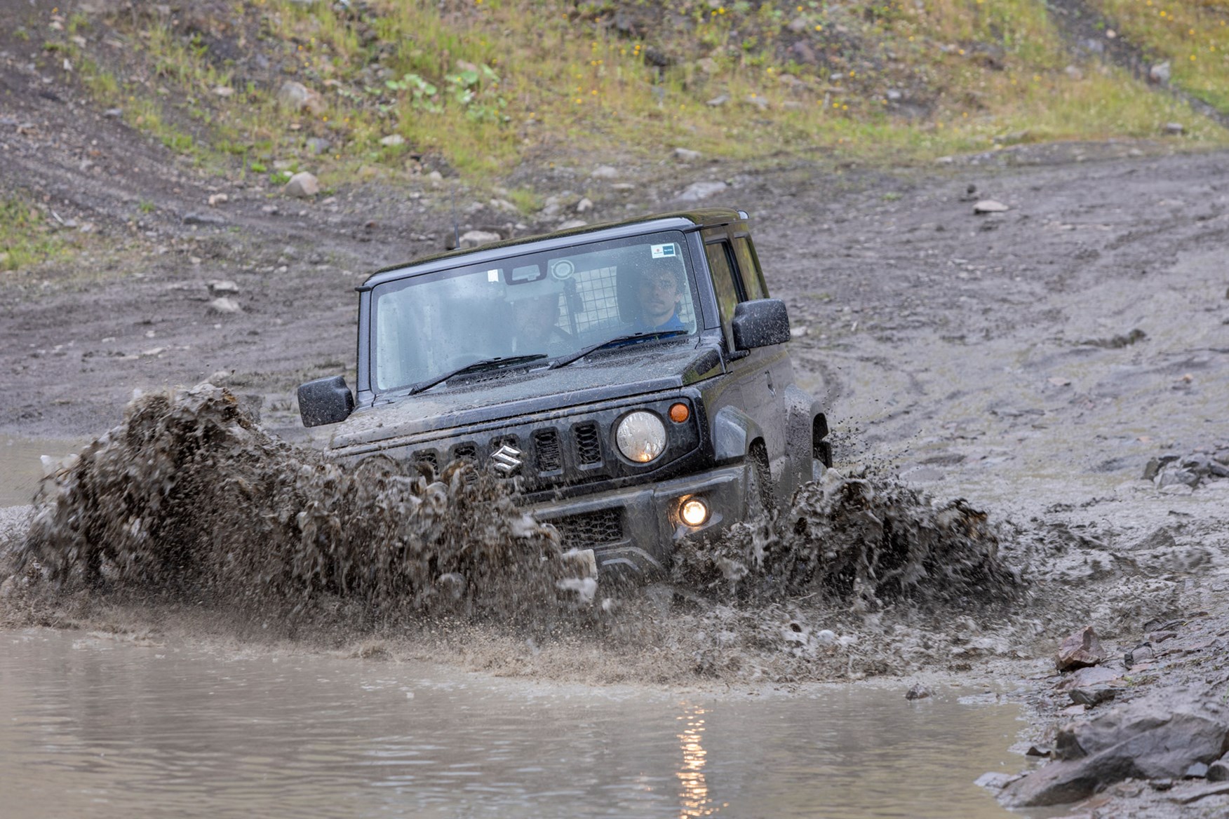 Suzuki Jimny commercial 4x4 review, 2021, front view, black, tackling water off-road