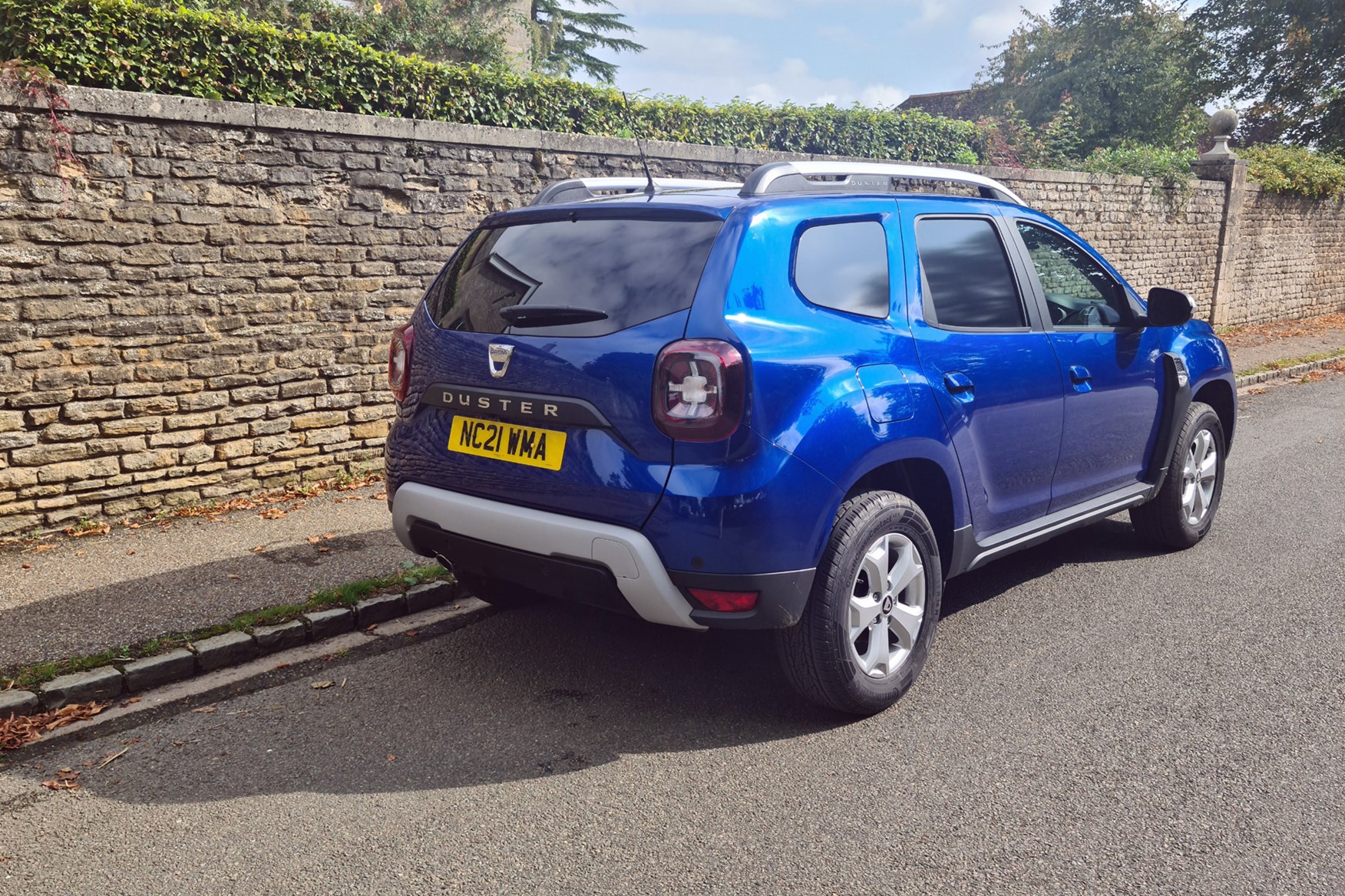 Dacia Duster Commercial review, rear view, blue, village street