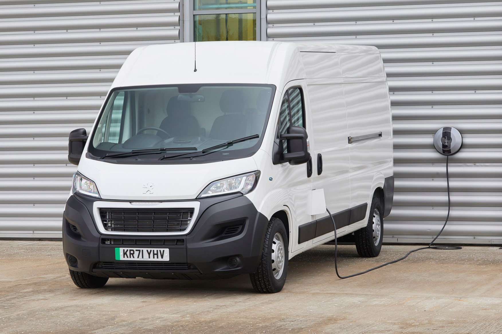 Peugeot e-Boxer electric van review - front view, plugged in charging