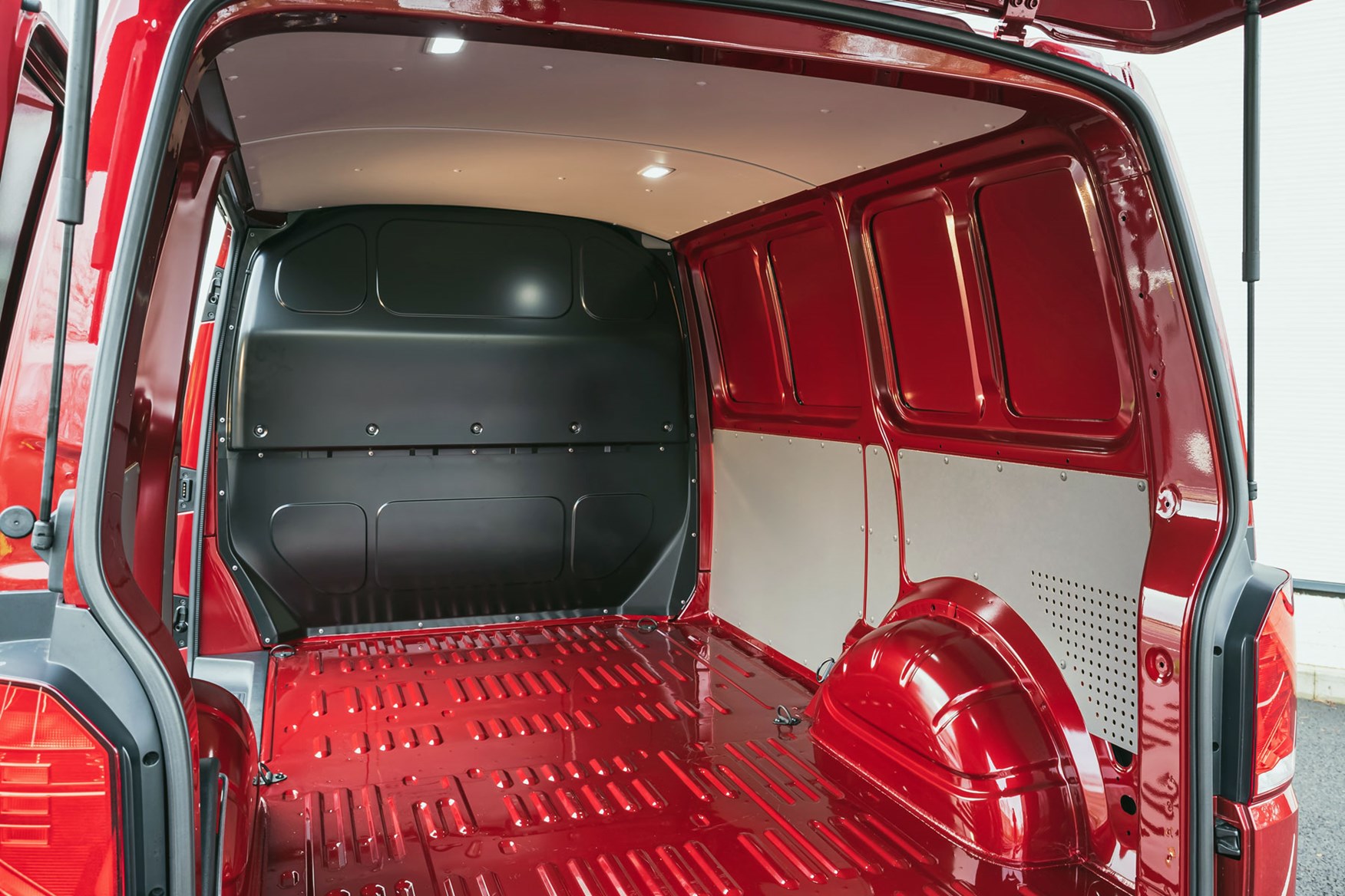 VW Transporter T6.1 load area, view from rear doors, red, 2020