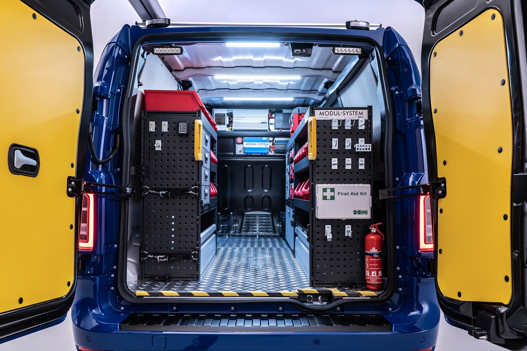 LEVC VN5 electric van load area viewed through rear doors, with racking, 2020