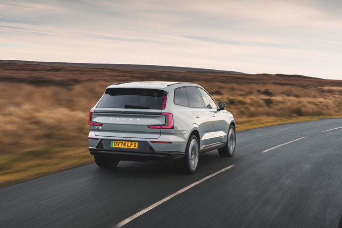 Volvo EX90 driving rear exterior