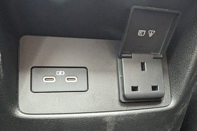 The three-pin plug in the back of the Mazda CX-60