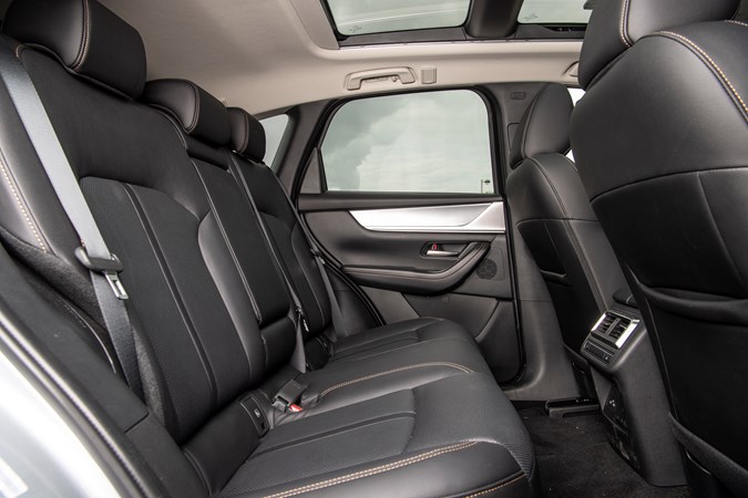 The back seats of the Mazda CX-60 lack support and the ride is firm with five adults inside