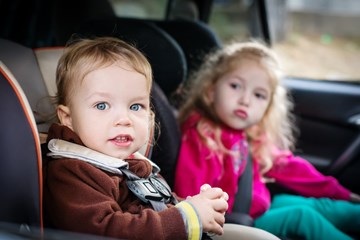 Children in back seat of car