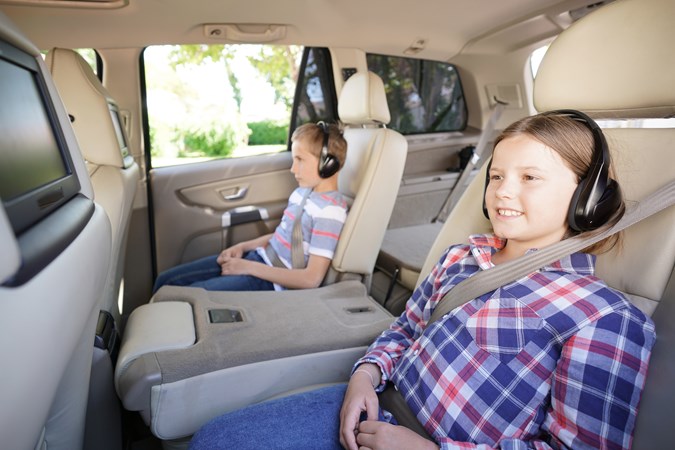 Children watching DVDs in a car