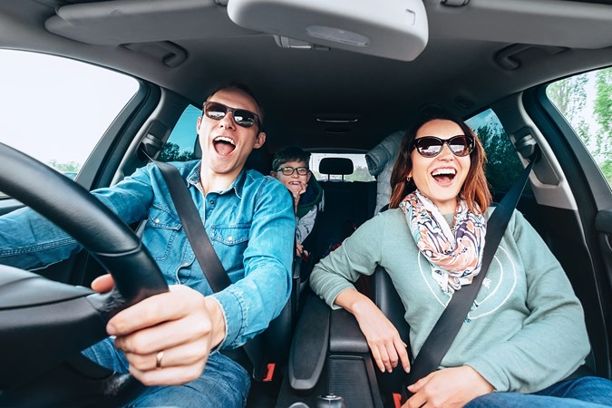 Family singing in car