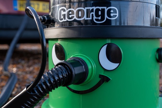 A close up of the face printed on the George vacuum cleaner 
