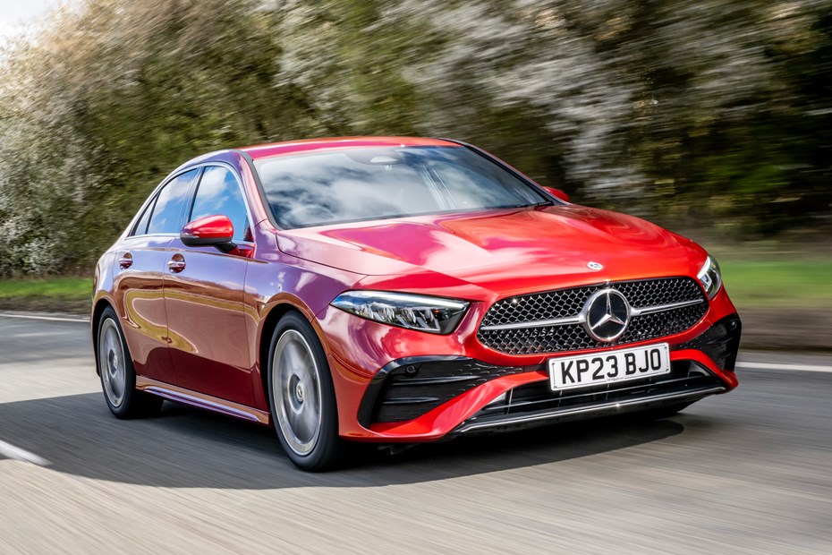 Mercedes A-Class Saloon, front three quarter tracking, red paint, wooded background