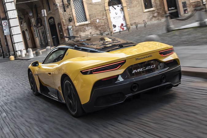 Maserati MC20 (2025) review: rear three quarter driving, yellow paint