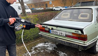 Aaron Hussain washing Audi 80 with Worx cordless pressure washer