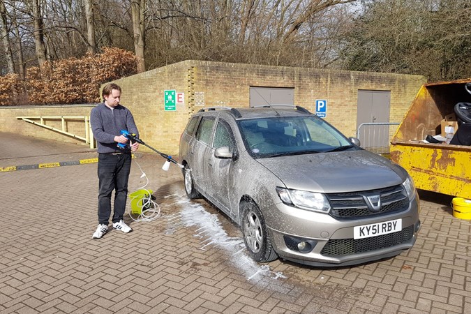 Dave Kirby using a Draper D20 pressure washer to clean a Dacia Logan