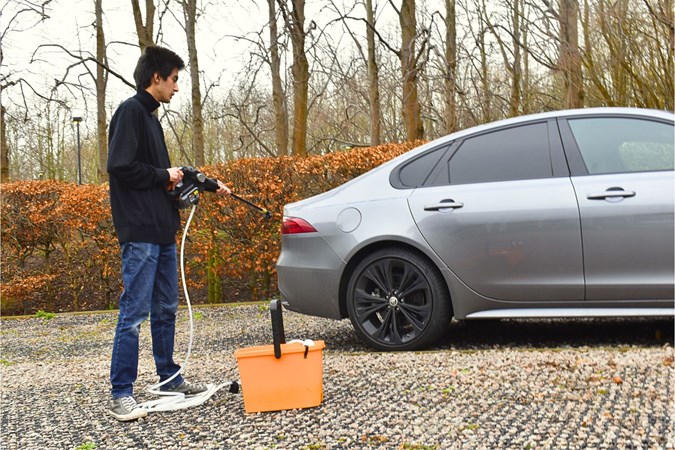 Aaron Hussain cleaning a Jaguar XF with Worx Nitro Hydroshot