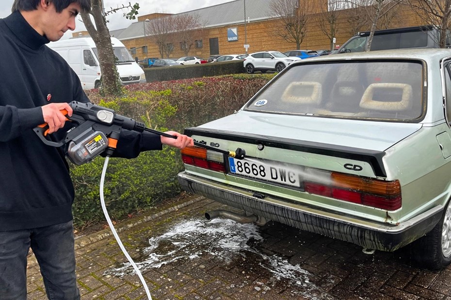 Aaron Hussain cleans car with cordless pressure washer