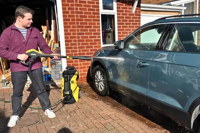 Ryan Gilmore spraying VW with Karcher K7 pressure washer